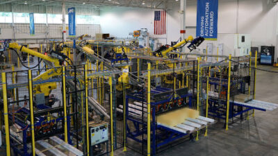 Figure 1: Robotic material handling and custom automation was part of an upgrade for a thermoforming customer in the food and beverage industry. The new automation was to fit between and connected to two existing manufacturing processes on multiple production lines in a 24/7 operation. Courtesy: Applied Manufacturing Technologies