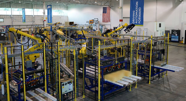 Figure 1: Robotic material handling and custom automation was part of an upgrade for a thermoforming customer in the food and beverage industry. The new automation was to fit between and connected to two existing manufacturing processes on multiple production lines in a 24/7 operation. Courtesy: Applied Manufacturing Technologies