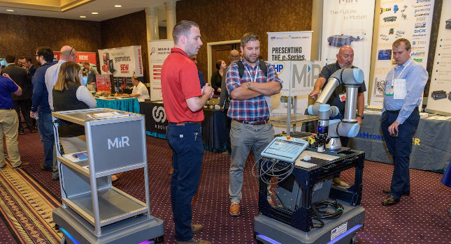 Attendees of the inaugural Autonomous Mobile Robot Conference got to interact with autonomous mobile robots throughout the day in the exhibit area. Courtesy: Robotics Industries Association (RIA)