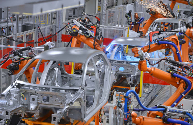 Through TSN capabilities, robots are working on a project.