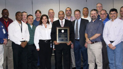 Ted Masters, HART Communication Foundation president and CEO (third from right), presents the 2013 HART Plant of the Year Award to The Dow Chemical Company – Deer Park Acrylates Trip Reduction and Site Leadership teams. Courtesy: HART Communication Founda