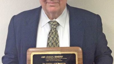 Dan Jones proudly displays his lifetime achievement award from SMMA for outstanding contributions to the electric machines industry. Courtesy: Incremotion Associates