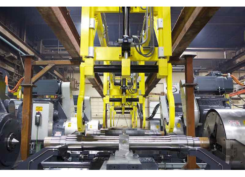 Figure 1: Euro Machinery Specialists recently remanufactured a 1960s vintage Snyder “Three-Stage” lathe machining line for work in the production of rail and locomotive axles. The turning line synchronizes left-head and right-head Siemens Simotics 150-hp