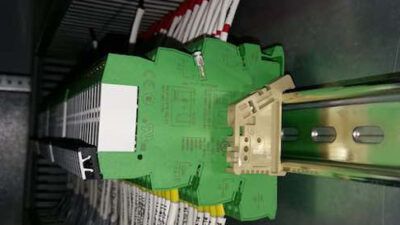 Figure 5: The interface relay base, or socket, shown in green, provides the connections to the coil and contacts of the relay. The actual relay, shown in white, contains the coil and contacts, which provide the switching function needed. Courtesy: Shady Y