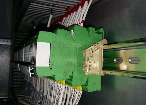 Figure 5: The interface relay base, or socket, shown in green, provides the connections to the coil and contacts of the relay. The actual relay, shown in white, contains the coil and contacts, which provide the switching function needed. Courtesy: Shady Y