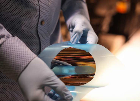 A nickel film peel-off from a silicon wafer demonstrates the concept of using a 2-D-material-based transfer process for wafers. Courtesy: Jose-Luis Olivares, MIT