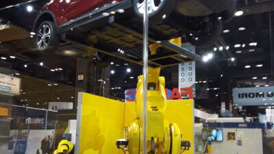 A sports utility vehicle received a lift by a Fanuc robot in an IMTS 2018 automotive application demonstration at the Fanuc booth. The lifting robot is integrated with motion of the Otto Motors mobile robot that serves as a mobile base for a second Fanuc robot. Courtesy: Mark T. Hoske, Control Engineering, CFE Media