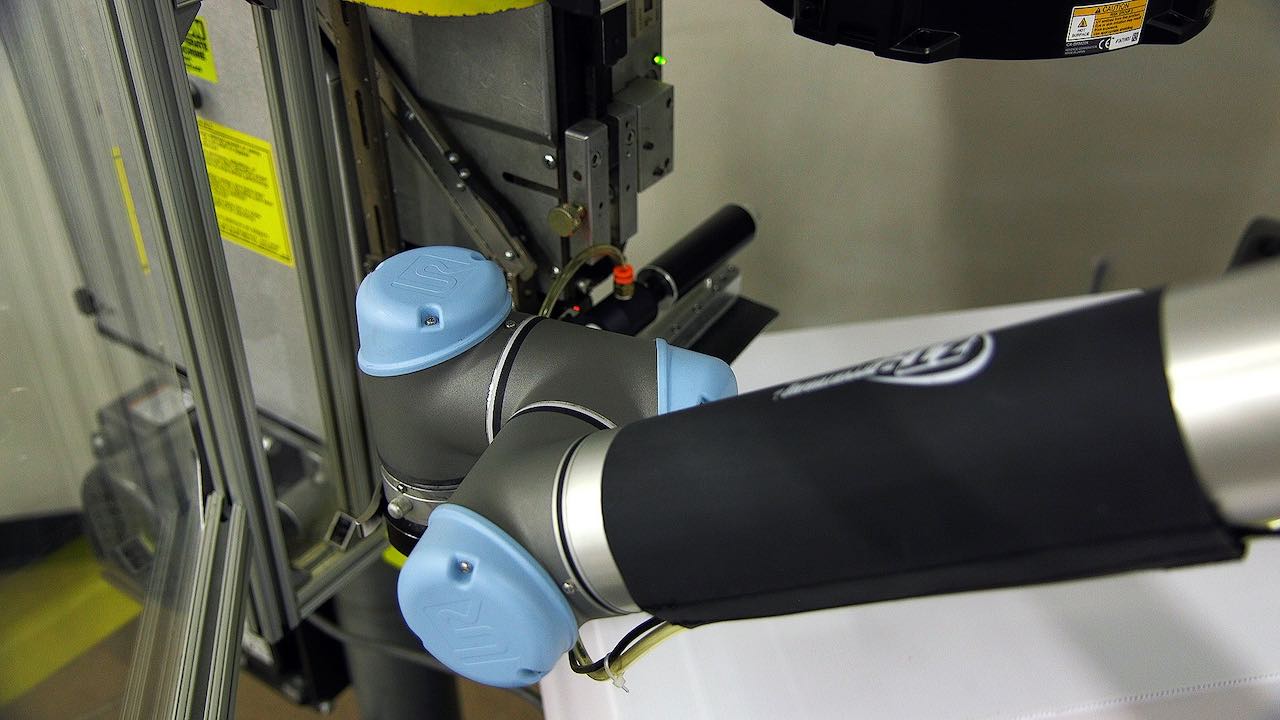 Zippertubing, in the wire and cable management and protection business, devised a wrap-around Velcro sleeve for the robot arm to keep the cables for air lines and electrical systems along the arm in place. “We can take it off and change it over as we change products, as the I/O changes,” said Tim Mead about the product they have commercialized for other Universal Robots users. Courtesy: Universal Robots