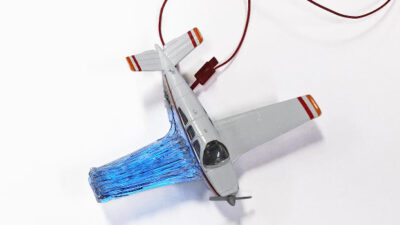 Using the 3D printing method developed by the MIT researchers, a structure such as this model airplane wing could have both light emitters and light detectors embedded in the material, so that it could continuously detect any micro-cracks as they begin to form. Courtesy: Felice Frankel, MIT