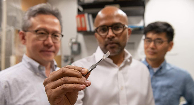 Seung Soon Jang, an associate professor, Faisal Alamgir, an associate professor, and Ji Il Choi, a postdoctoral researcher, all in Georgia Tech’s School of Materials Science and Engineering, examine a piece of platinum-graphene catalyst. Courtesy: Allison Carter, Georgia Tech University