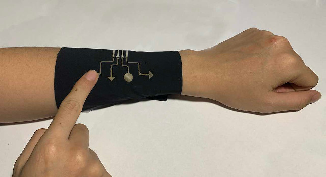 This sleeve incorporates the new electronic material, allowing it to function as a video game controller. Courtesy: North Carolina State University