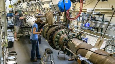 Students work during the summer with Purdue’s Mach 6 quiet wind tunnel. The tunnel will be involved in research by a new multidisciplinary hypersonics program. Courtesy: John Underwood, Purdue University
