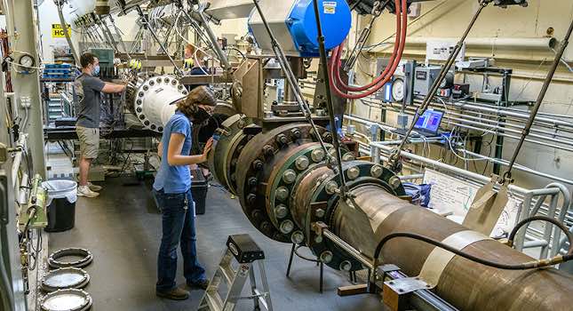 Students work during the summer with Purdue’s Mach 6 quiet wind tunnel. The tunnel will be involved in research by a new multidisciplinary hypersonics program. Courtesy: John Underwood, Purdue University