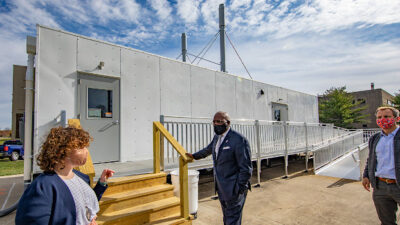 Professor Harley Johnson, far right, the associate dean for research at the Grainger College of Engineering, joins Wooldridge and Jones outside the mobileSHIELD facility. Courtesy: Fred Zwicky, University of Illinois