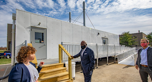 Professor Harley Johnson, far right, the associate dean for research at the Grainger College of Engineering, joins Wooldridge and Jones outside the mobileSHIELD facility. Courtesy: Fred Zwicky, University of Illinois