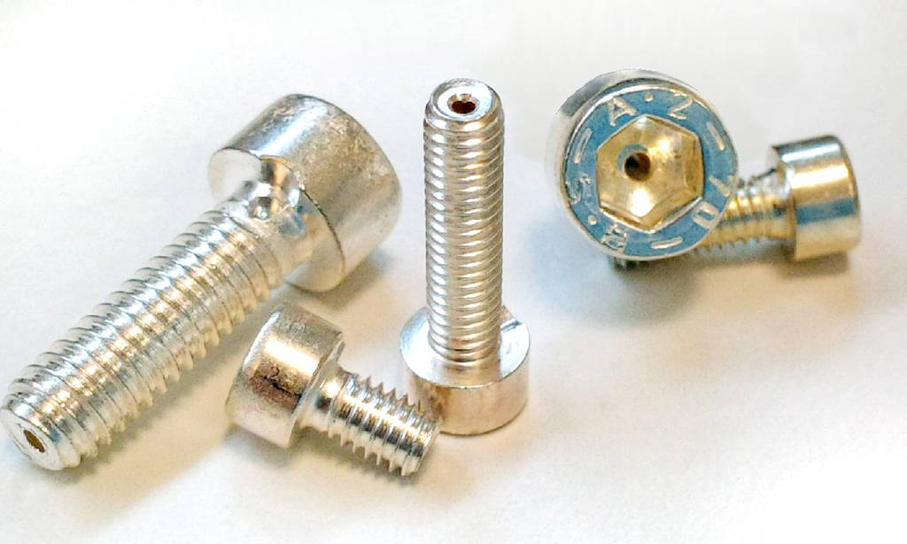 Figure 5: Example for Design-for-Vacuum: Drilled silver-plated screws for venting of trapped volumes in vacuum. Courtesy: PI