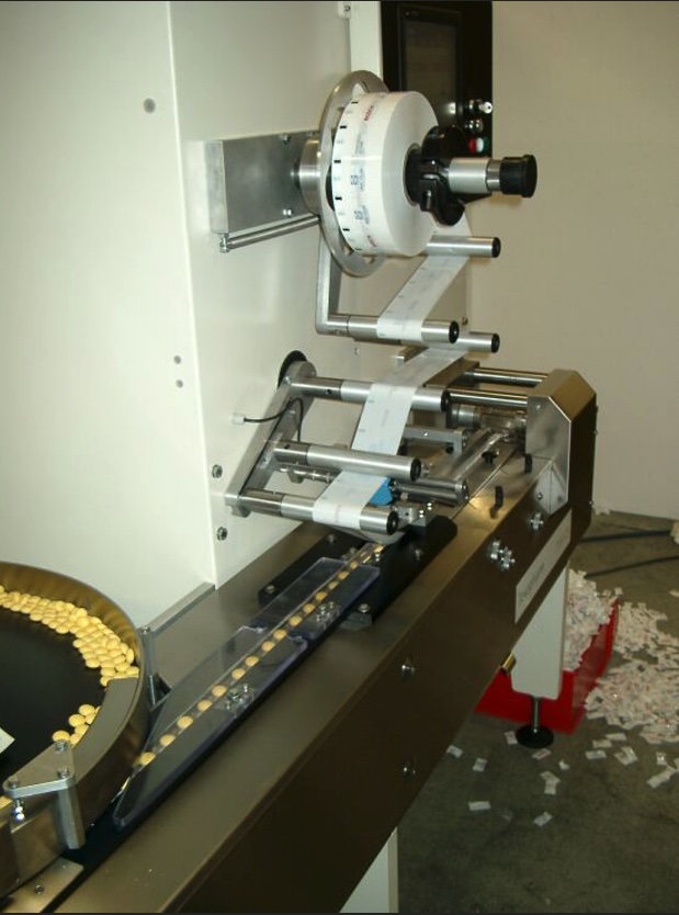 Figure 7: Overview of the infeed of the product to be packed, and the packaged product (on the floor). Courtesy: PLCopen