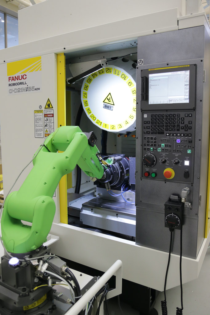 Integrating a collaborative robot to automate a CNC machine is quick and simple with a new communications protocol that allows the two systems to talk to each other. Courtesy: FANUC America Corporation/Association for Advancing Automation (A3)