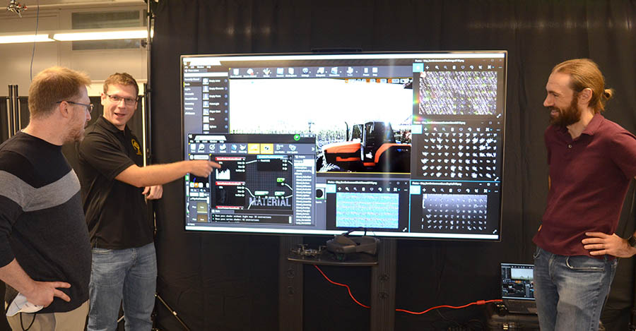 (Left to right) Associate Professor Derek Anderson, PhD candidate Brendan Alvey and Assistant Research Professor Andrew Buck discuss the simulated data they’re using to train artificial intelligence (AI). Courtesy: University of Missouri