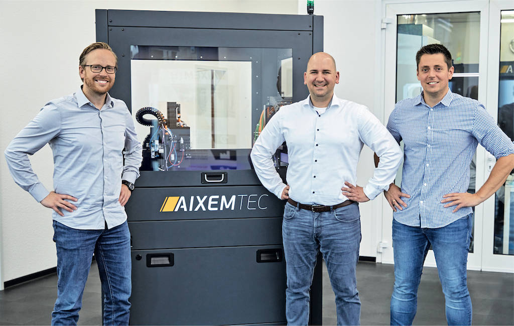 From left to right: Aixemtec Managing Director Sebastian Haag, Christian Kukla, Application and University Management at the Beckhoff Aachen Office, and Sebastian Sauer, Head of Machine Development at Aixemtec, standing in front of the component assembly system. Courtesy: Beckhoff Automation