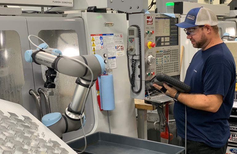 Machine shop Fusion OEM in Chicago, Illinois, has deployed UR cobots to tend its CNC machines in lights-out production. The cobots enabled the company to cut its delivery time in half, taking a 500 unit order from six to three days delivery. Courtesy: A3/Fusion OEM