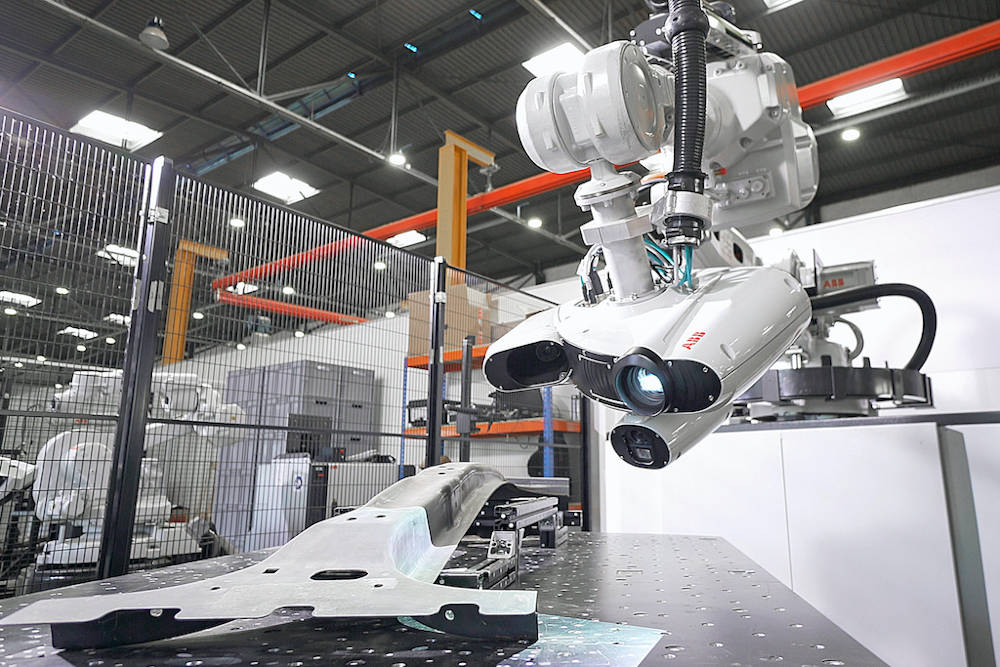 Robotic quality inspection system uses 3D optics and artificial intelligence to scan an automotive part for geometric and surface variations compared to digital CAD models. Rapid feedback allows for quick process changes. Courtesy: A3/ABB Inc.