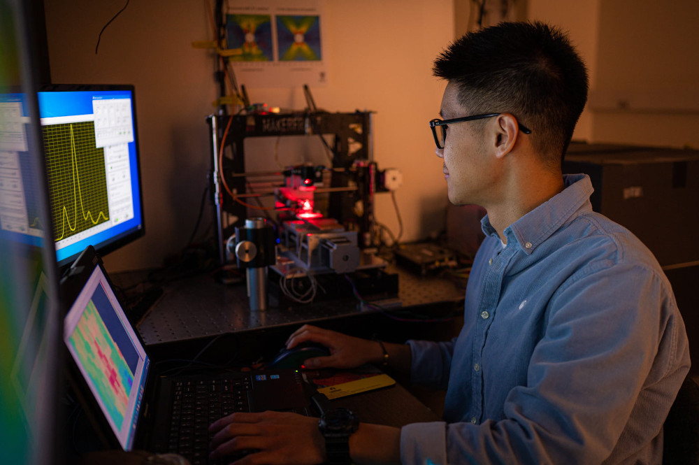 Graduate student Wei Meng works at a test rig at a Rice University lab, validating measurements of strain in a variety of materials with strain-sensing smart skin. Courtesy: Jeff Fitlow, Rice University
