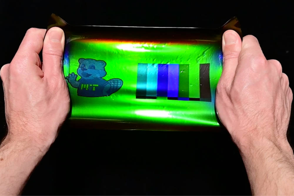 By applying a 19th-century color photography technique to modern holographic materials, an MIT team has printed large-scale images onto elastic materials that when stretched can transform their color, reflecting different wavelengths as the material is strained. Courtesy: Massachusetts Institute of Technology