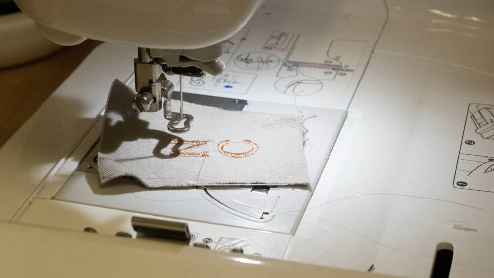 Yu Chen, graduate student at NC State, demonstrates embroidery techniques. Courtesy: North Carolina State University