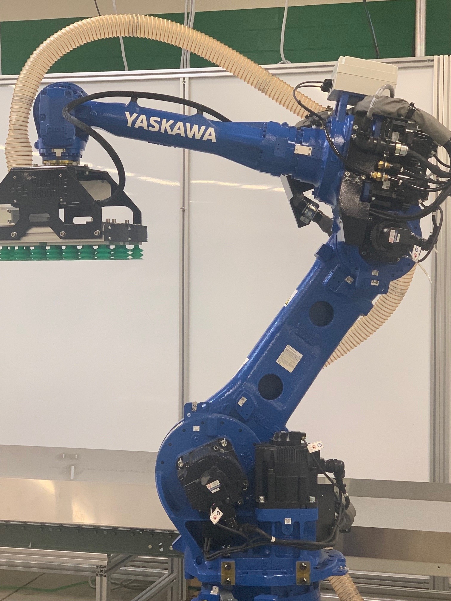 A Yaskawa PL80 robot with VEO Robotics FreeMove 3D safeguarding facilitates flexible mixed-case depalletizing. Courtesy: Calvary Robotics