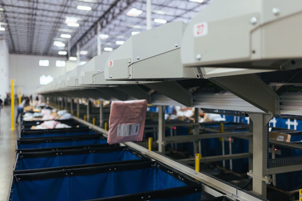 Figure 6: After the shoe sorter fires, each parcel falls from the 22-inch chute into the correct bin. Courtesy: Foreword LLC, NPI, Beckhoff Automation 