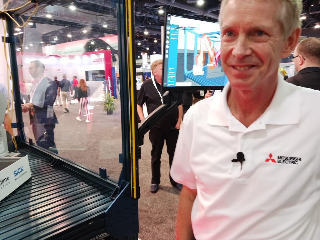 Patrick Varley, Mitsubishi Electric Automation marketing manager, demonstrated a 3D bin picking package with three robots, at Pack Expo Las Vegas 2023. The integrated package allows adding automation to existing lines to increase throughput and help with labor shortages, as many companies are unable to fill positions. 