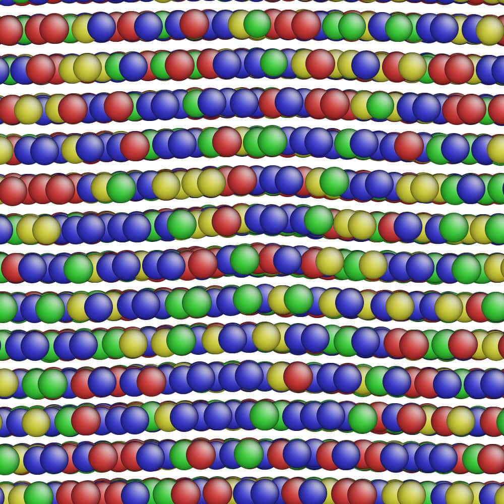 Colored circles represent atoms of different metals in this model simulation of an alloy. Some rows of metal atoms in the alloy’s structure are bending due to natural imperfections in the alloy’s structure. How these imperfections move under stress and strain could impact an alloy’s strength, which is why the collaborative research team is visualizing them with both microscopy and simulations to train their machine-learning model how to predict alloy strength. Courtesy: Liang Qi, associate professor of materials science and engineering, College of Engineering.