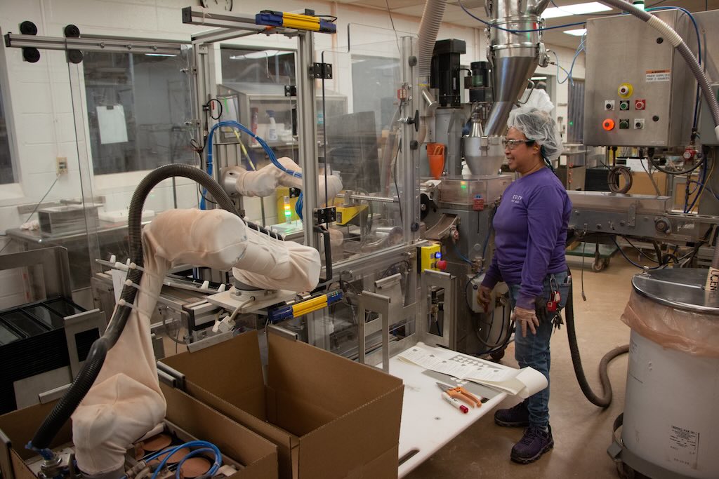 While some workers at Coty Cosmetics were initially fearful of robots taking over part of their jobs, they are now very appreciative of their new cobot colleagues as they take over several tedious tasks such as doing the quality inspection of each godet. “Now there’s a computer doing all of that work,” says Paul Baublitz, project manager at Coty Cosmetics. “If you see something that needs to be improved, you can immediately react.” 
