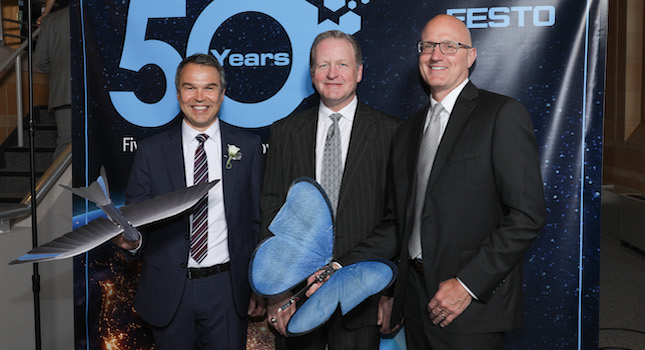 Most of the more than 100 guests at the Festo 50th Anniversary Gala held in Cincinnati had their pictures taken with the Bionic Swift and Butterfly – Festo flying robots modeled after nature. From left to right: Frank Notz, Festo Management Board Member; Bill Gerbig, President of Ralph W. Earl; and Mark Snyder, Director of Festo North America Channel Management. Courtesy of: Festo U.S.