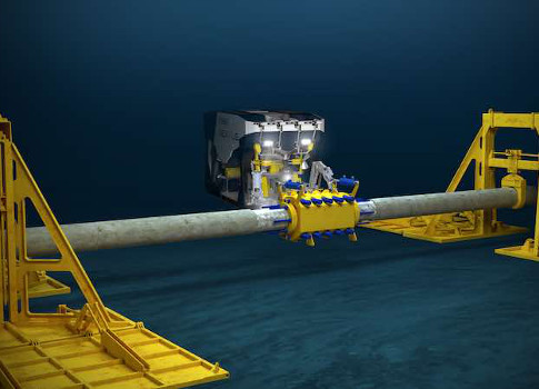 In this repair situation, the pipe lift frames are in place and the remote operated vehicle (ROV) is installing a smart clamp. Courtesy: Oceaneering
