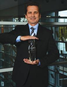 Representing the 2014 System Integrators of the Year in the $10 to $18 million category is Dr. Vladimir Morenko, Director General of Insist Avtomatika.