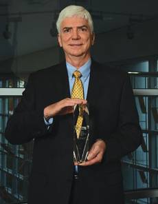 Representing the 2014 System Integrators of the Year in the over $18 million category is Richard Seale, President of the Automation Business Unit at Wood Group Mustang.