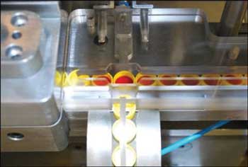 This is a closeup of the inspection/rejection lane during inspection. Courtesy: Balluff Inc.