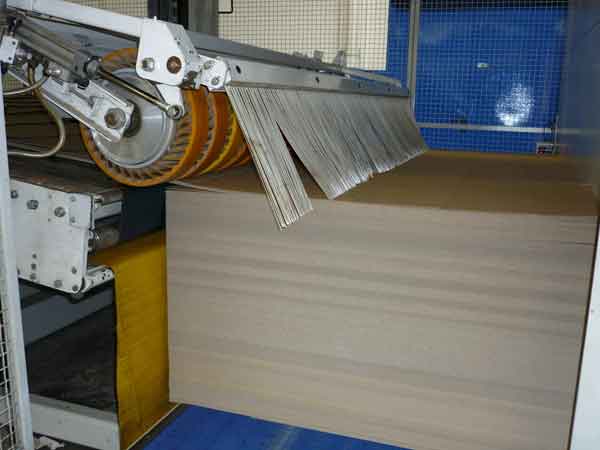 Corrugated box plant uses a non-contact laser encoder to accurately measure board speed and reduces scrap. Courtesy: Beta LaserMike