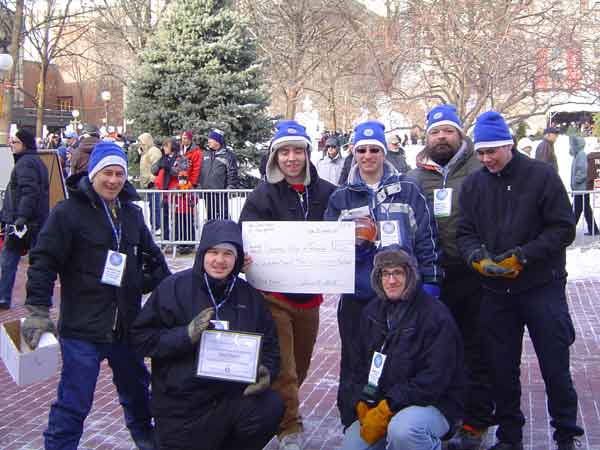 Dunwoody College team (minus one) celebrates the $500 third-place award in the 2011 Annual Autonomous Snowplow Competition. Courtesy: E.J. Daigle, Dunwoody College Above the plow, a Banner U-Gage ultrasonic sensor with a sensing range of 150 mm to 1 meter detected distance on the U-shaped course. Courtesy: E.J. Daigle, Dunwoody College