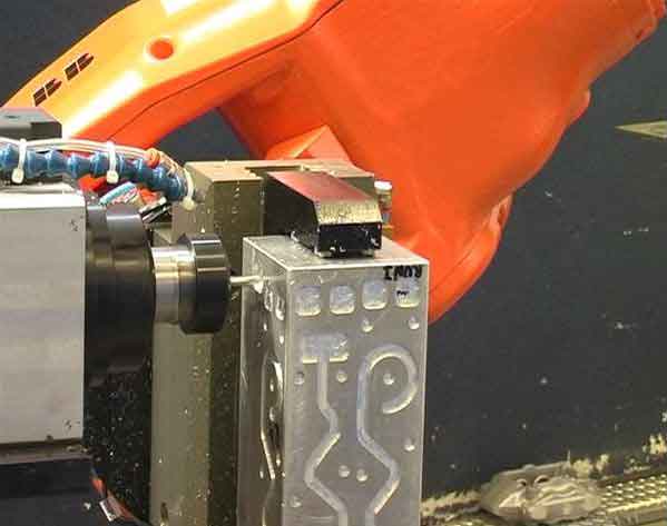 COMET project test execution: machining of the aluminum workpiece for a different robot configuration (DOE ½ Factorial Plan, 6 factors, 2 levels). Courtesy: COMET