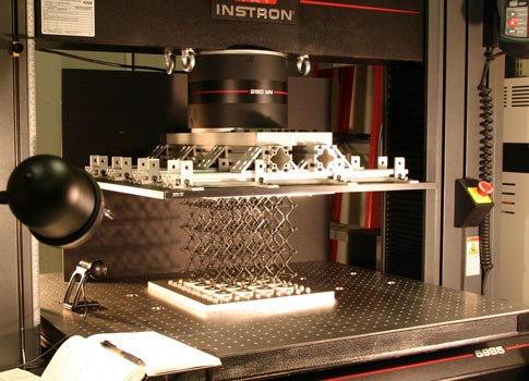 In the lab, a sample of the cellular composite material is prepared for testing of its strength properties. Photo courtesy of Kenneth Cheung and MIT according to terms listed here http://web.mit.edu/press/media.html?id=15203.