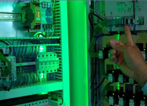 The flat cable plugs into the back of the HMI-PLC unit, eliminating a gateway or communication card. It connects serially to other control panel devices using a snap-in connector for each. Courtesy: CFE Media