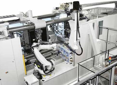 Figure 4: When a robot is added to an existing injection molding machine to unload parts, although each has a CE Mark, the combined system needs a new risk assessment. In this case, the U.S. manufacturer called upon Sick to assist in the risk assessment,