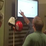 In the photo, inoLECT of Baton Rouge is training powerhouse operators on new 50-in. touchscreens. What’s under the hood? It integrates seven systems from five vendors, all with a common interface. Courtesy: Byte Size