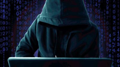 A hacker in the background.